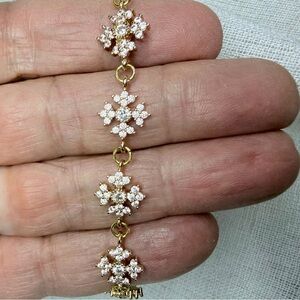 18K gold plated bracelet w sparkling white CZ snowflakes. 8”. Perfect GIFT